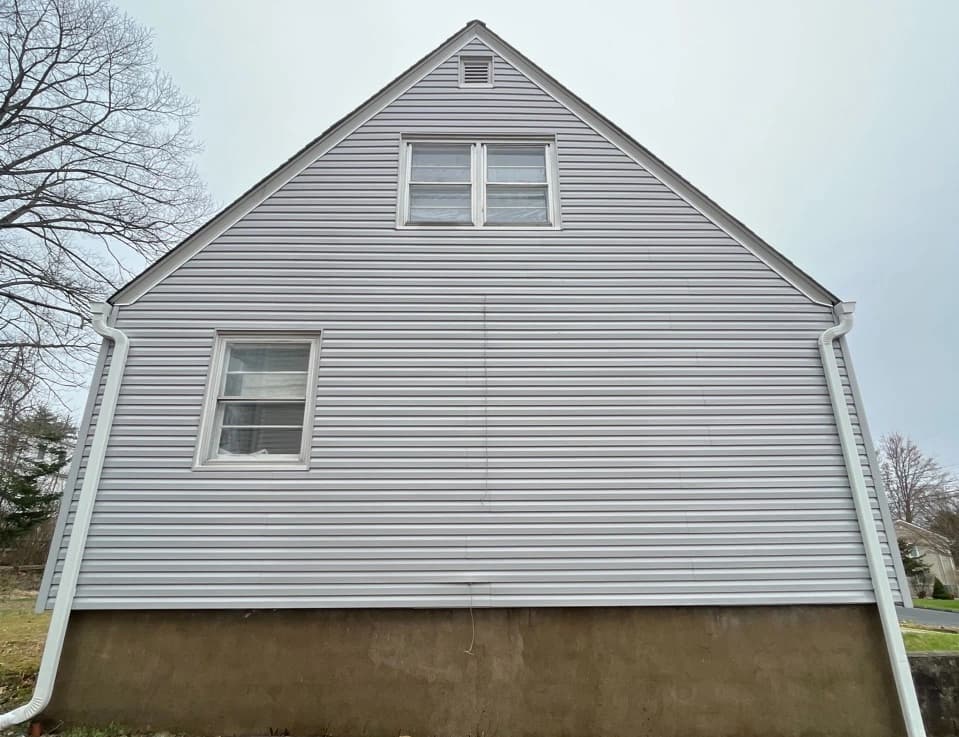 Willoughby Power Washing technician performing detailed house washing in Willoughby residential area